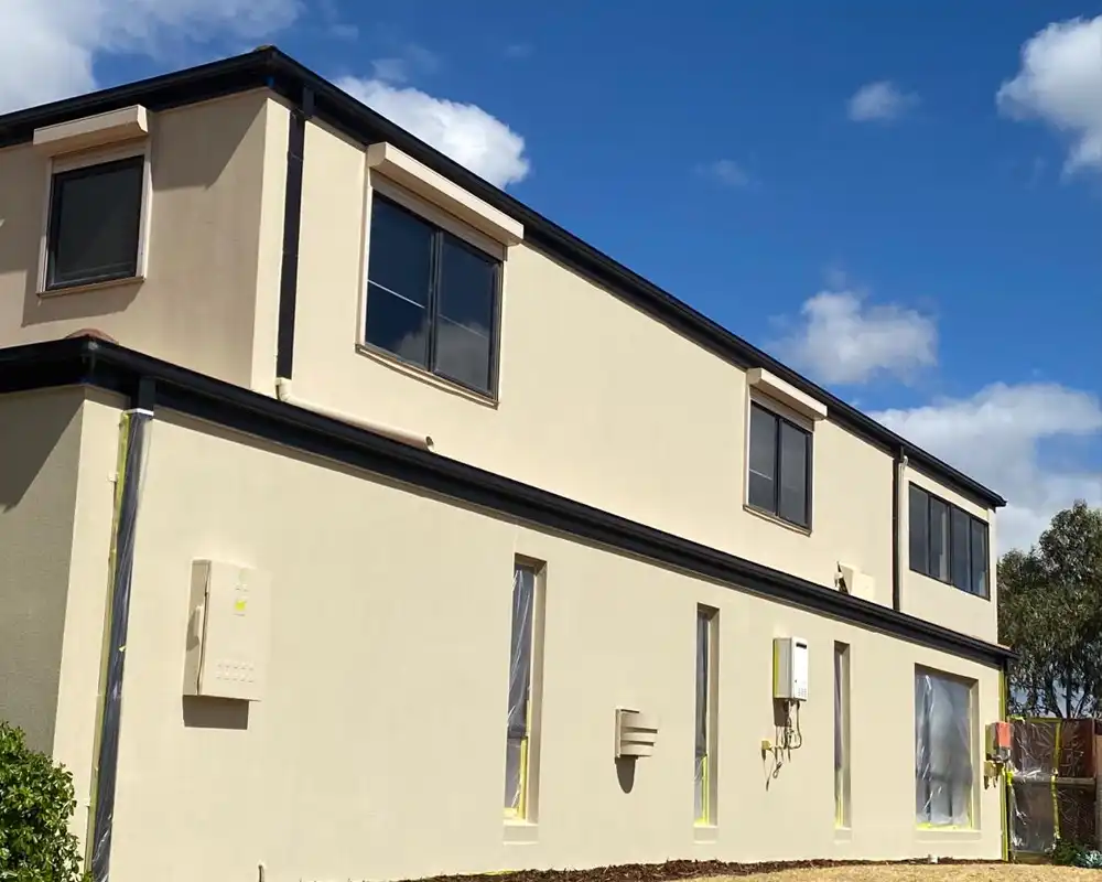 smooth beige render finish on modern double-storey home