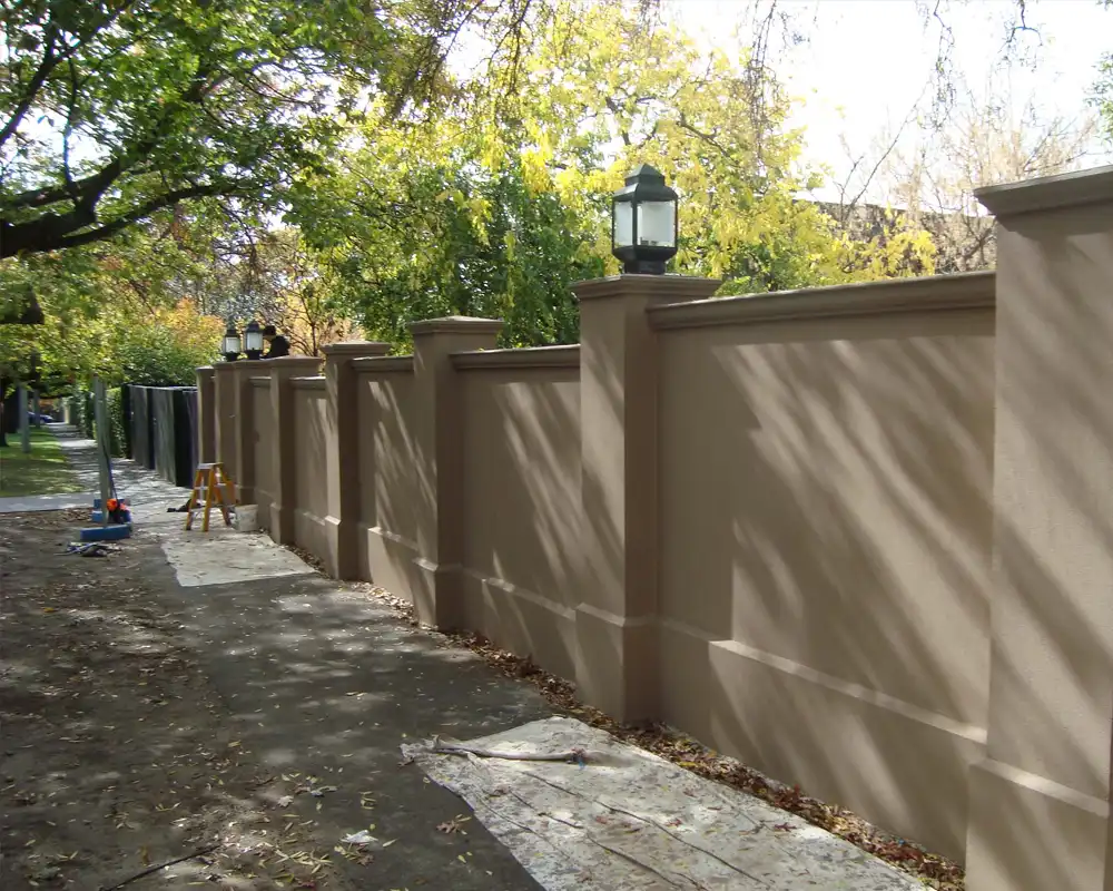 Cement rendering Sydney – smooth brown render finish on heritage boundary wall