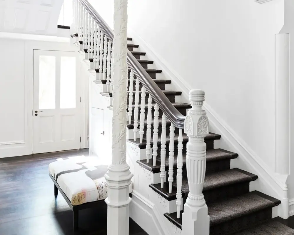 Interior woodwork painting Sydney – staircase, balustrades and trims with contrasting timber finishes.